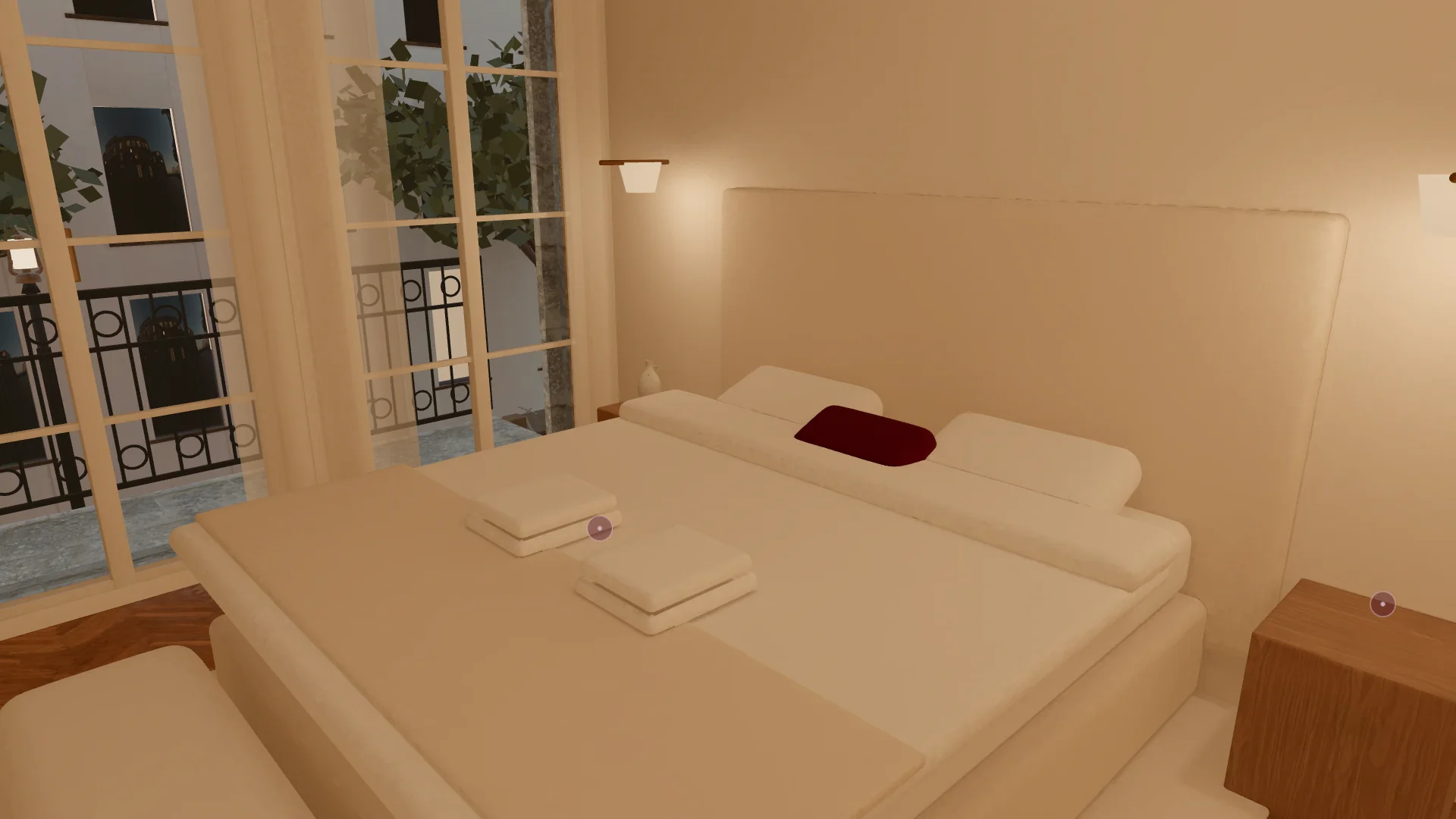 La chambre : lit fait avec des draps blancs, serviettes pliées, voilages lumineux et liseuses en laiton.